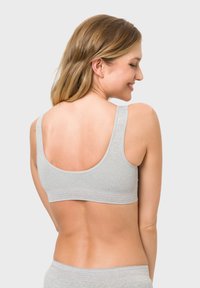 Grauer Baumwoll-Bralette mit breiten Trägern, nahtlosem Design und einem strukturierten Bund an der Unterkante, der einen komfortablen Sitz bietet.
