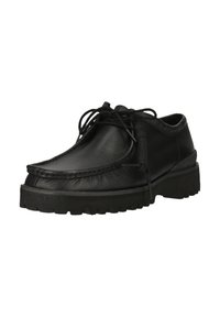 Chaussure à lacets en cuir noir avec dessus texturé, design mocassin à bout renforcé et semelle épaisse et robuste, présentée légèrement en angle sur fond blanc.