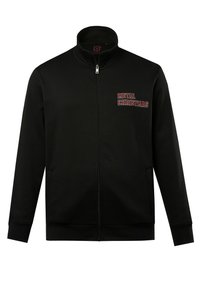 Sudadera negra con cremallera y cuello alto, que presenta "NAVIDAD METAL" en letras rojas en el lado izquierdo del pecho, fabricada con un tejido texturizado.