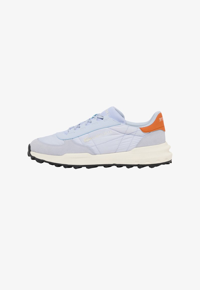 Light blue and white Lacoste sneaker with orange heel tab, black sole, and subtle logo on side, shown from outer side profile.