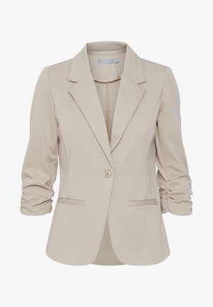 Beige blazer with a notched collar, single button closure, two front pockets, and ruched sleeves in a smooth, stretch fabric.