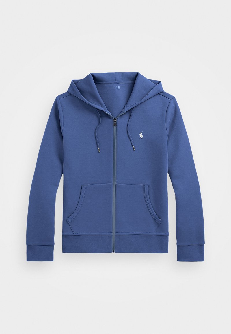 Blå zip-up hettegenser laget av mykt stoff, med hette, frontlommer, og en liten brodert logo på venstre bryst.