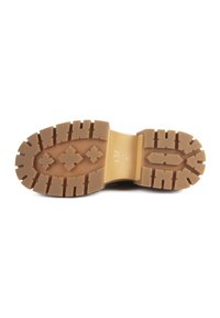 Semelle extérieure en caoutchouc marron avec des crampons multidirectionnels pour la traction. Présente un motif central en forme de diamant et une indication de taille "L37 37". Finition lisse.
