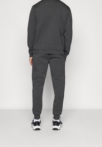 Ellesse Jogginghose - mottled black