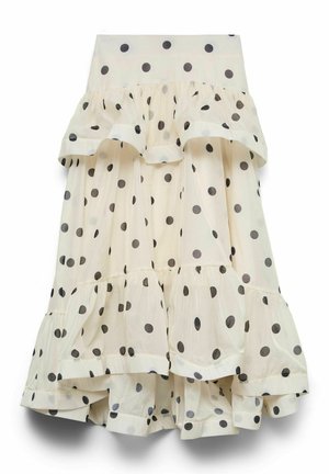 Jupe crème à étages avec pois noirs, volants superposés et un ourlet fluide et asymétrique.