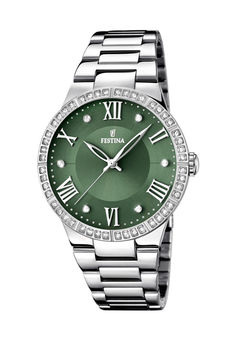 Srebrny zegarek ze stali nierdzewnej z zieloną tarczą, cyframi rzymskimi i bezelą wysadzaną kryształkami. Posiada gładki, wypolerowany design bransoletki.