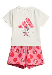 Weißes Baumwoll-T-Shirt mit pinkem Punkten-Design, das eine Cartoonfigur zeigt; passende pinke Shorts mit roten Punkten und Charakterdruck.