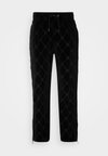 DISLACO - Pantalon de survêtement - black