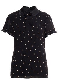 Blusa nera con colletto in satin e fiocco, caratterizzata da un motivo di stelle dorate. Maniche corte arricciate, tessuto leggero con una consistenza leggermente trasparente.