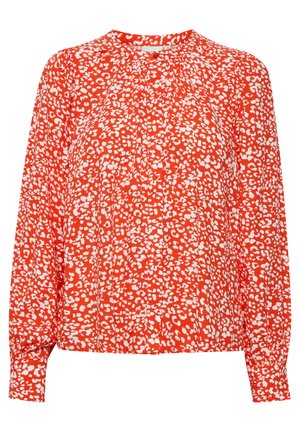 Rode blouse met een witte abstracte luipaardprint, ronde halslijn, lange mouwen en plooidetail aan de voorkant. Zachte, lichte stof.