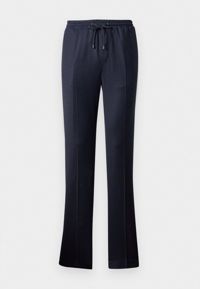 Marineblaue weite Hose aus weichem Stoff mit elastischem Bund und Kordelzug. Verfügt über eine glatte Textur und kein sichtbares Muster.