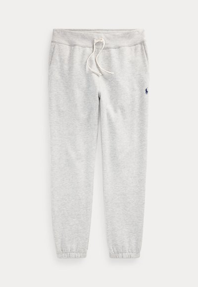 Pantaloni tuta grigio chiaro con polsini elastici, fascia in vita con coulisse, tasche laterali e piccolo logo scuro sulla parte alta della coscia sinistra.