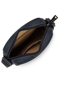 Navy leather crossbody bag with contrast stitching, zip closure, and a tan interior featuring two compartments for organization.