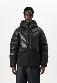 Helly Hansen VILLAGE UNISEX - Daunenjacke - black