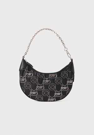 Black satin handbag with silver foil cat face pattern, chain strap, and black leather accents. Round shape with zip closure.