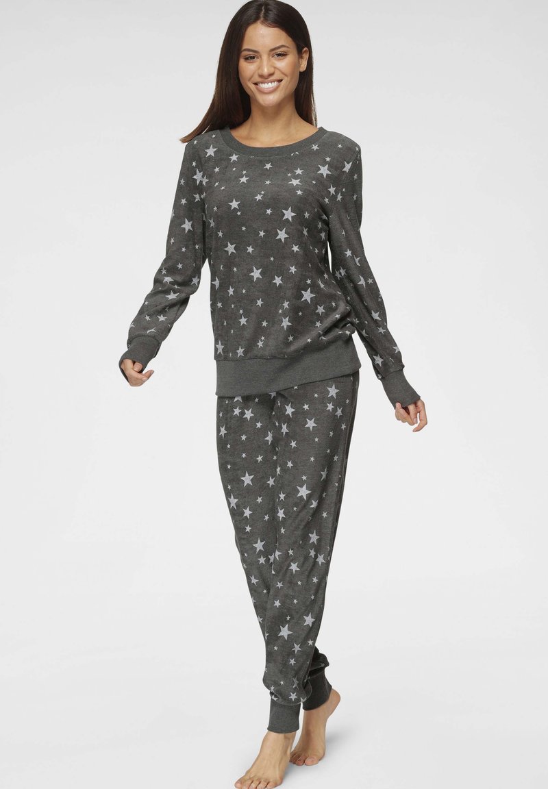 Gray pajama set featuring a long-sleeve top and pants adorned with white stars. Soft material and elastic cuffs with a simple, casual design.