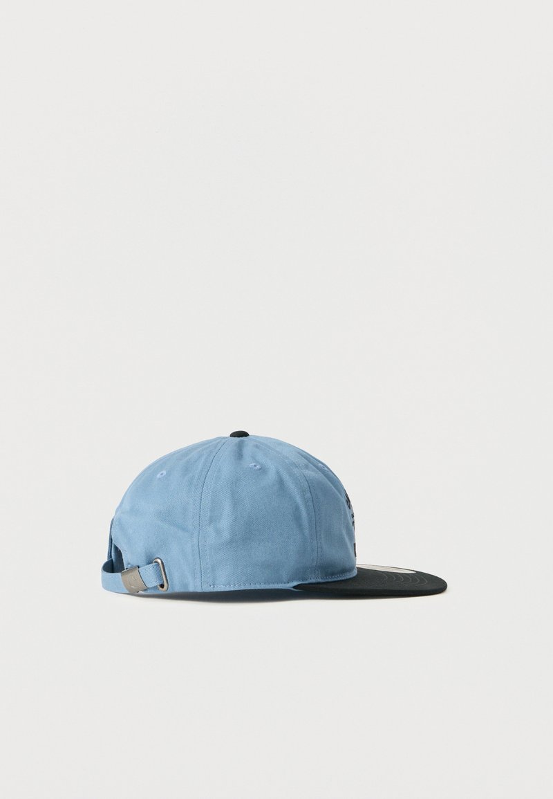Light blue baseball cap with adjustable strap and metal buckle, paired with a flat black brim, shown from side on white background.
