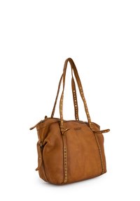 Brown leather handbag with two long handles, studded accents along the sides, top zipper closure, and a branded front panel.