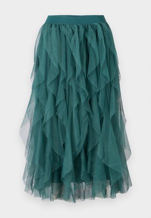 Türkiz tüllszoknya réteges fodrokkal, rugalmas derékkal és lágy eséssel. Az anyag könnyű és átlátszó.