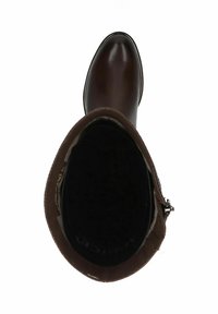 Botín de piel marrón con un acabado suave, puntera redondeada y detalles de cierre de cremallera. El interior cuenta con un forro suave y una suela texturizada.