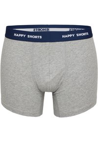Grå bomullsboxershorts med blå elastisk midjeband som har vit text "HAPPY SHORTS". Slät textur, åtsittande stil och mellanlång klippning.