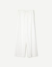 White wide-leg pants with an elastic waistband and drawstring, made from lightweight fabric.