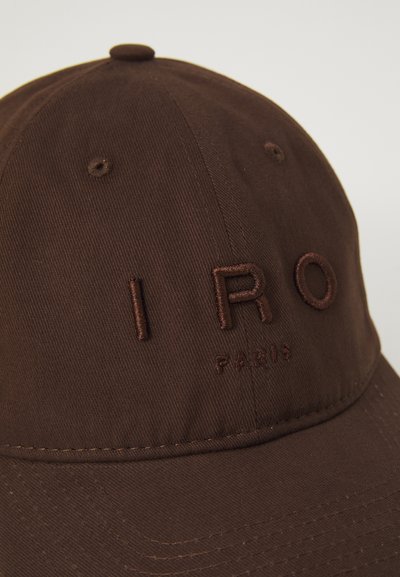 Dark brown baseball cap with embroidered text "IRO" in large letters and "PARIS" in smaller letters below on front panel.