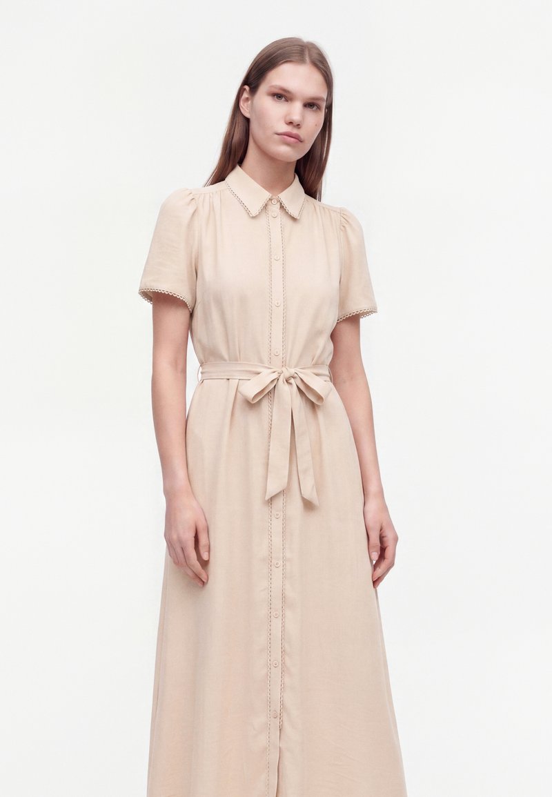 new look beige dress BANDEAU PRINTED JUNGLE MIDI DRESS IN BEIGE-BELLA GALVAN