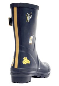 Botte de pluie en caoutchouc noir avec des accents dorés, des motifs floraux et des motifs en nid d'abeille. La botte possède un dessus texturé et une semelle robuste.