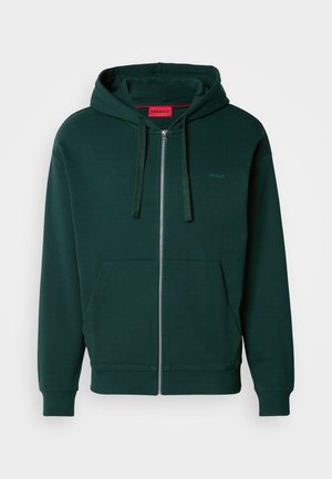 Green zip-up hoodie with a kangaroo pocket, drawstring hood, and ribbed cuffs. Features a small logo on the left chest area. Soft fabric texture.