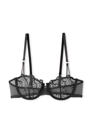 Soutien-gorge en dentelle noire avec des bords festonnés, des panneaux en maille, des bretelles ajustables et une couverture modérée. Il présente une broderie florale complexe sur les bonnets.