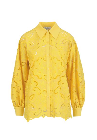 Dzeltena garroku pogāta blūze ar ziedu izgriezumu mežģīņu rakstu, smailu apkakli, elastīgām aprocēm un viļņotu apakšmali.