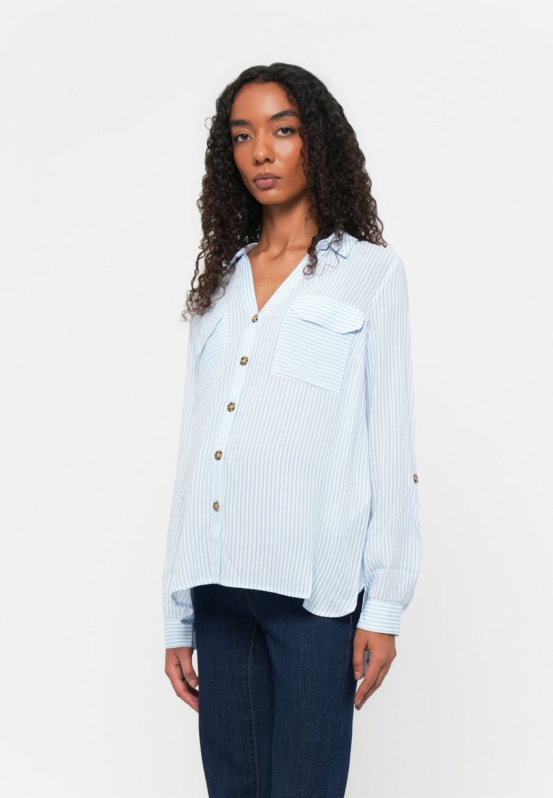 Light blue button-up shirt with vertical white stripes, two chest pockets, and gold buttons. Long sleeves with buttoned cuffs.