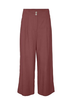 Pantalon large taille haute couleur rouille avec deux boutons argentés à la ceinture et des plis cousus à l'avant.