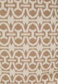 Textile with a geometric pattern featuring beige and cream colors. The design includes interlocking circles and rectangular shapes, with textured woven details.