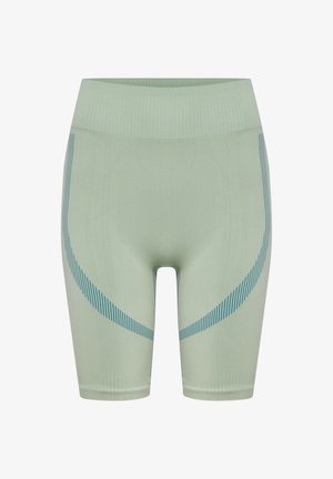 Hellgrüne nahtlose Biker-Shorts mit hoher Taille, geripptem Bund und blauen, geschwungenen Streifenmustern auf den Oberschenkeln.