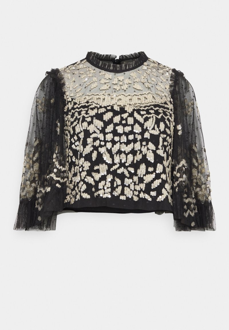 Crop top noir avec des manches en tulle noir transparent, orné de motifs floraux en sequins dorés et argentés complexes et d'un col à volants.