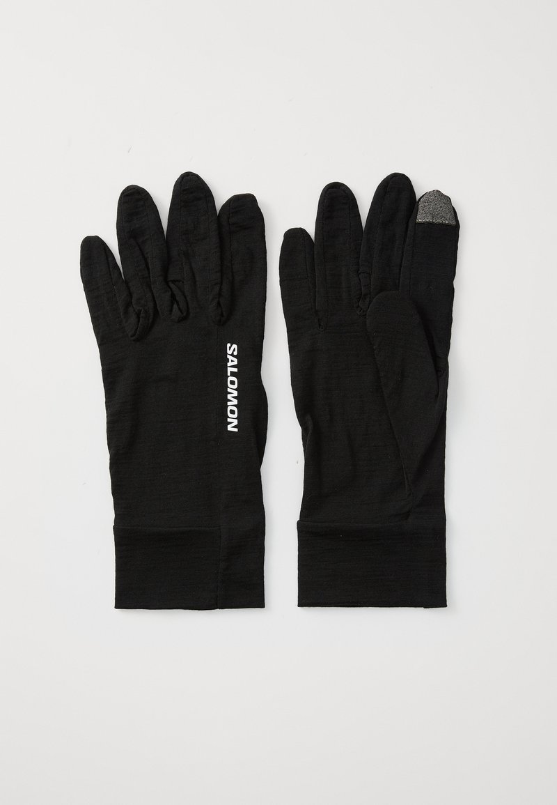 Gants noirs en tissu texturé, avec une segmentation des doigts et un bout de doigt sensible au toucher. Logo "SALOMON" en blanc sur le côté.