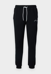 Μαύρο παντελόνι φόρμας από βαμβακερό μείγμα ύφασμα. Διαθέτει ελαστική μέση με κορδόνια σε λευκό χρώμα και μικρό λευκό κεντημένο λογότυπο κοντά στη λεκάνη.