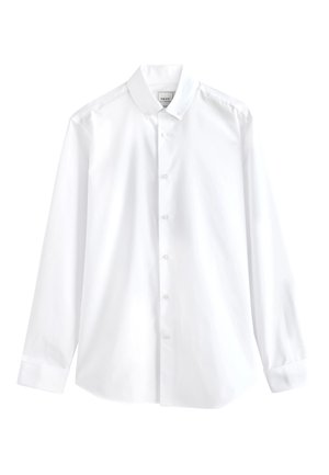 Chemise blanche à manches longues boutonnée, col boutonné, étiquette visible à l'intérieur du col et poignets plissés aux manches.