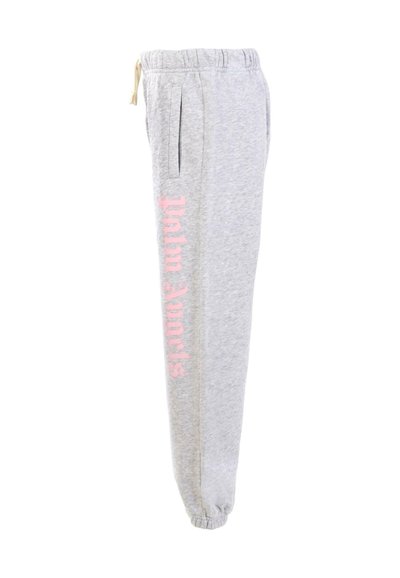 Grijze sweatpants met een elastische tailleband en trekkoord, voorzien van zijzakken en roze tekst "palm angels" op het been.