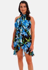 Vestido de playa floral en tejido transparente, con un vibrante patrón de flores azul y verde sobre un fondo negro, con diseño de cuello halter.