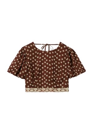 Crop top marron à manches courtes avec motifs de soleils crème et bordure florale, doté d'une fermeture à nouer dans le dos au niveau de l'encolure.
