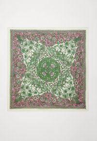 Square silk scarf featuring a floral pattern in green and pink with a central circular design. Edges have a decorative border.