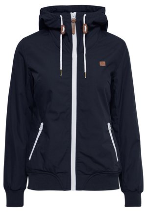 Veste à capuche bleu marine en tissu lisse, dotée d'une fermeture éclair blanche, de deux poches latérales avec zippers et de poignets élastiques. Accents marron sur la capuche.