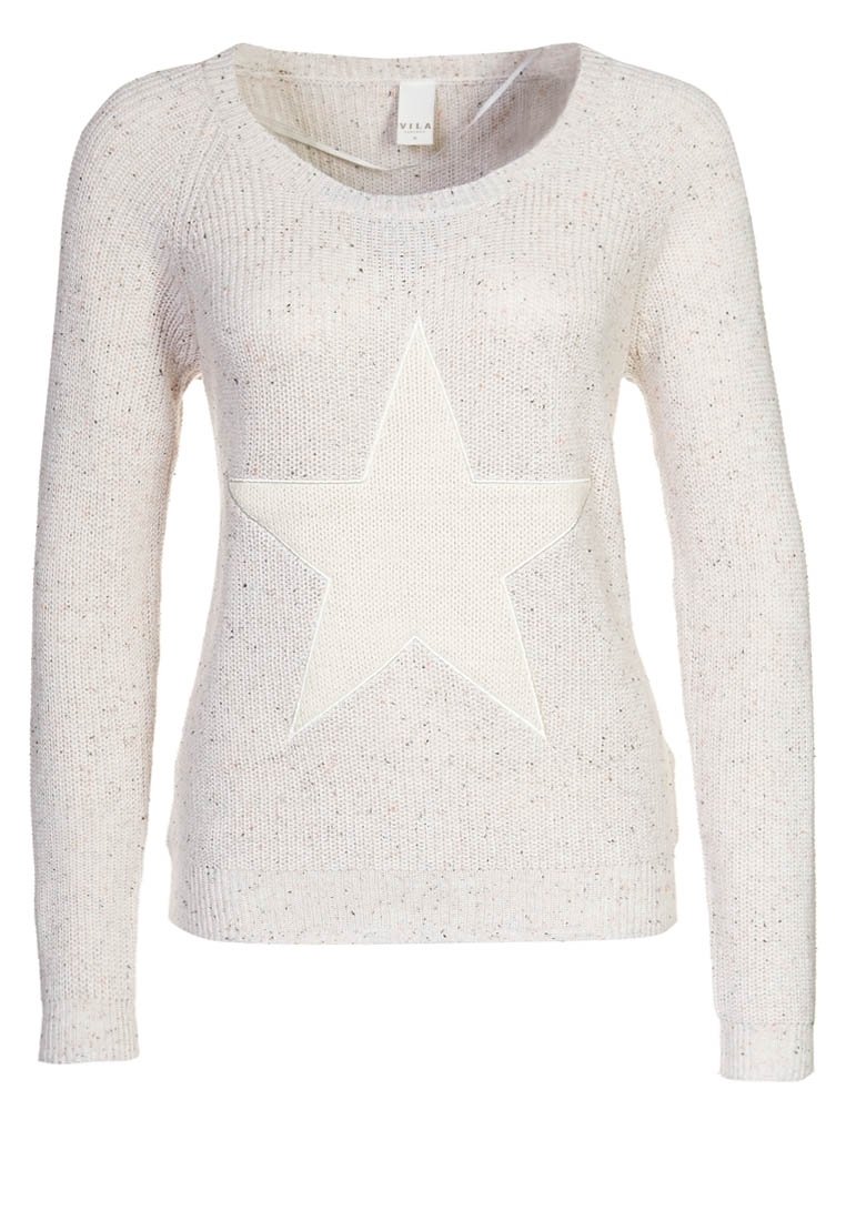Gebreide trui in lichtbeige met een textuurafwerking. Heeft een groot wit sterrenpatroon in het midden, een ronde hals en lange mouwen.