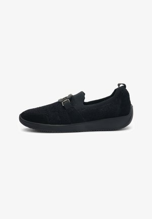 Black slip-on shoe with textured fabric upper, rubber sole, and front strap with buckle detail, shown in side profile.
