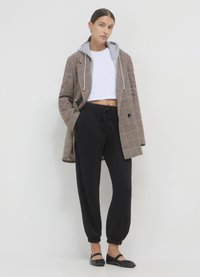Calliope GINNICO UNITA - Pantalon de survêtement - ultrablack
