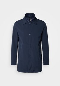 Cappotto leggero blu navy con chiusura a bottoni, colletto a punta, due tasche laterali e tessuto morbido. Adatto per varie condizioni climatiche.