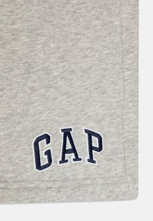 Grå sweatshirt med marineblå broderet "GAP"-logo. Blødt stof med en glat tekstur, med rund halsudskæring og korte ærmer.